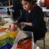AOB student working on KFA mural: Arts on the Block student working on mural.