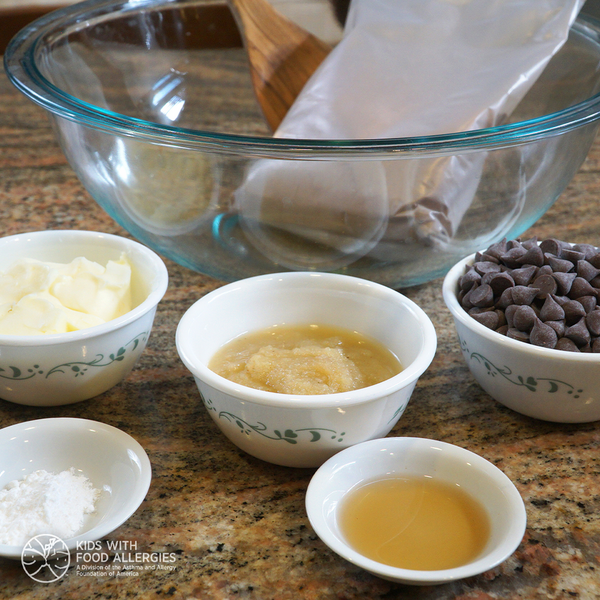 A picture of allergy-friendly cake mix cookies ingredients – cake mix, margarine, applesauce, baking powder, flavoring, and mix-ins