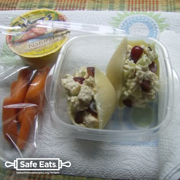 Allergy-friendly chicken salad in pasta shells with baby carrots and applesauce