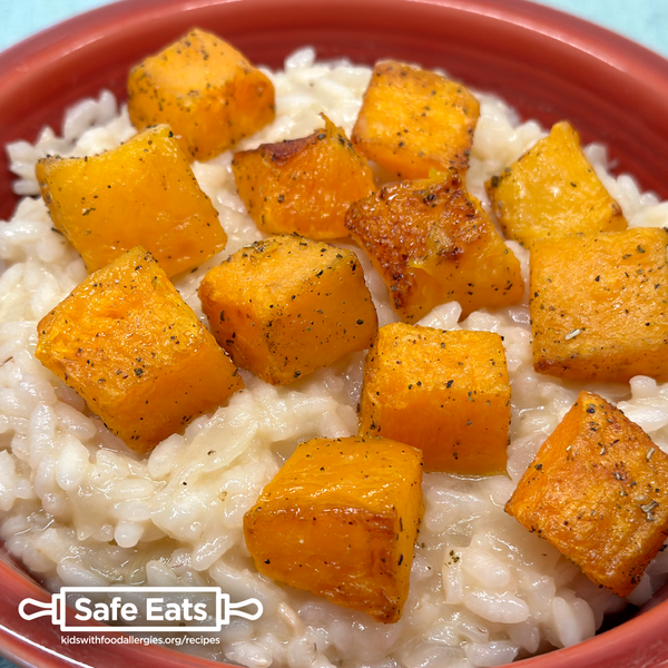 Allergy-friendly pumpkin risotto in a red bowl